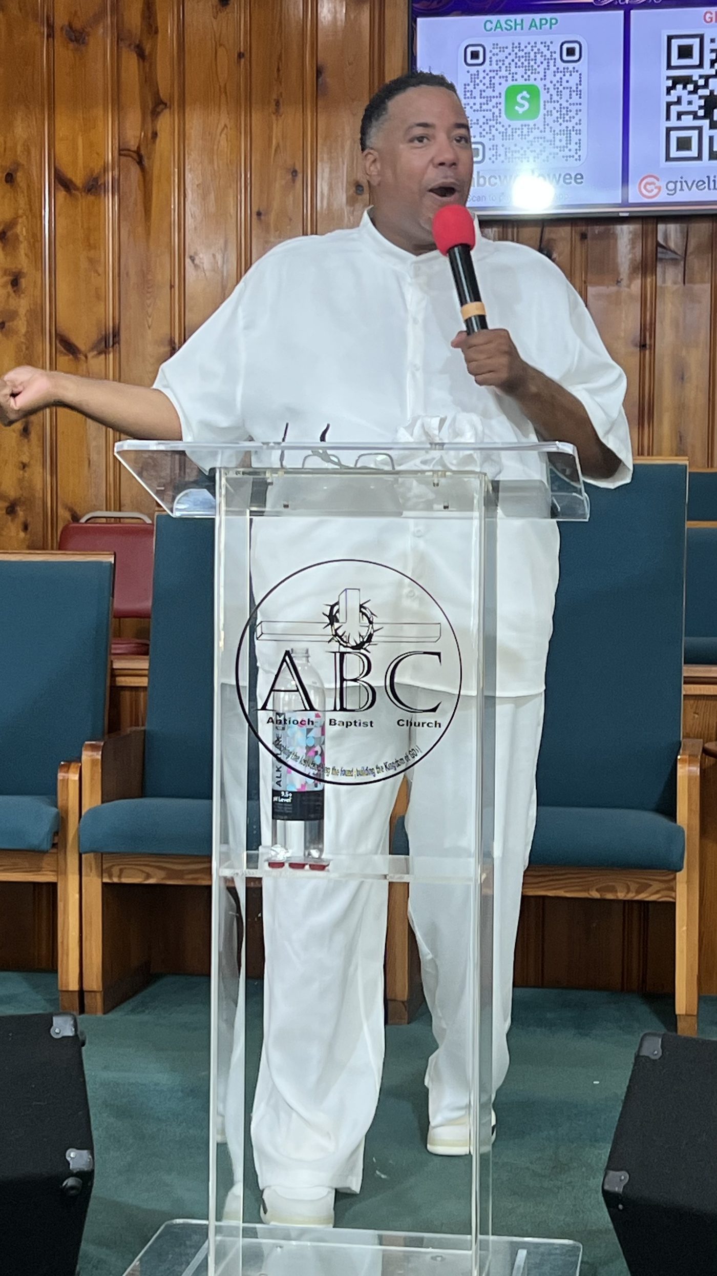 Pastor Cash preaching from the pulpit at Antioch Baptist Church